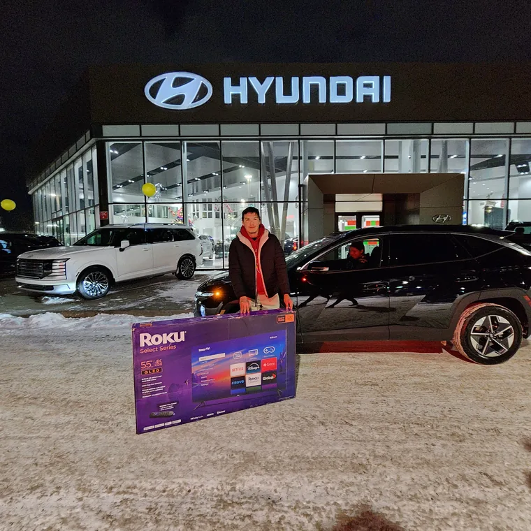Happy customer with new vehicle